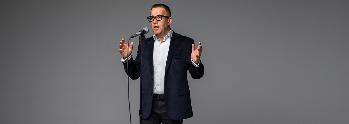 Man in a suit singing