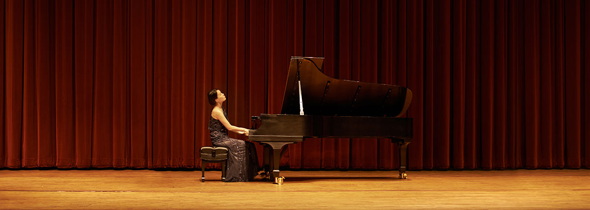 Female pianist performing on stage