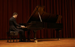 Male pianist performing on stage
